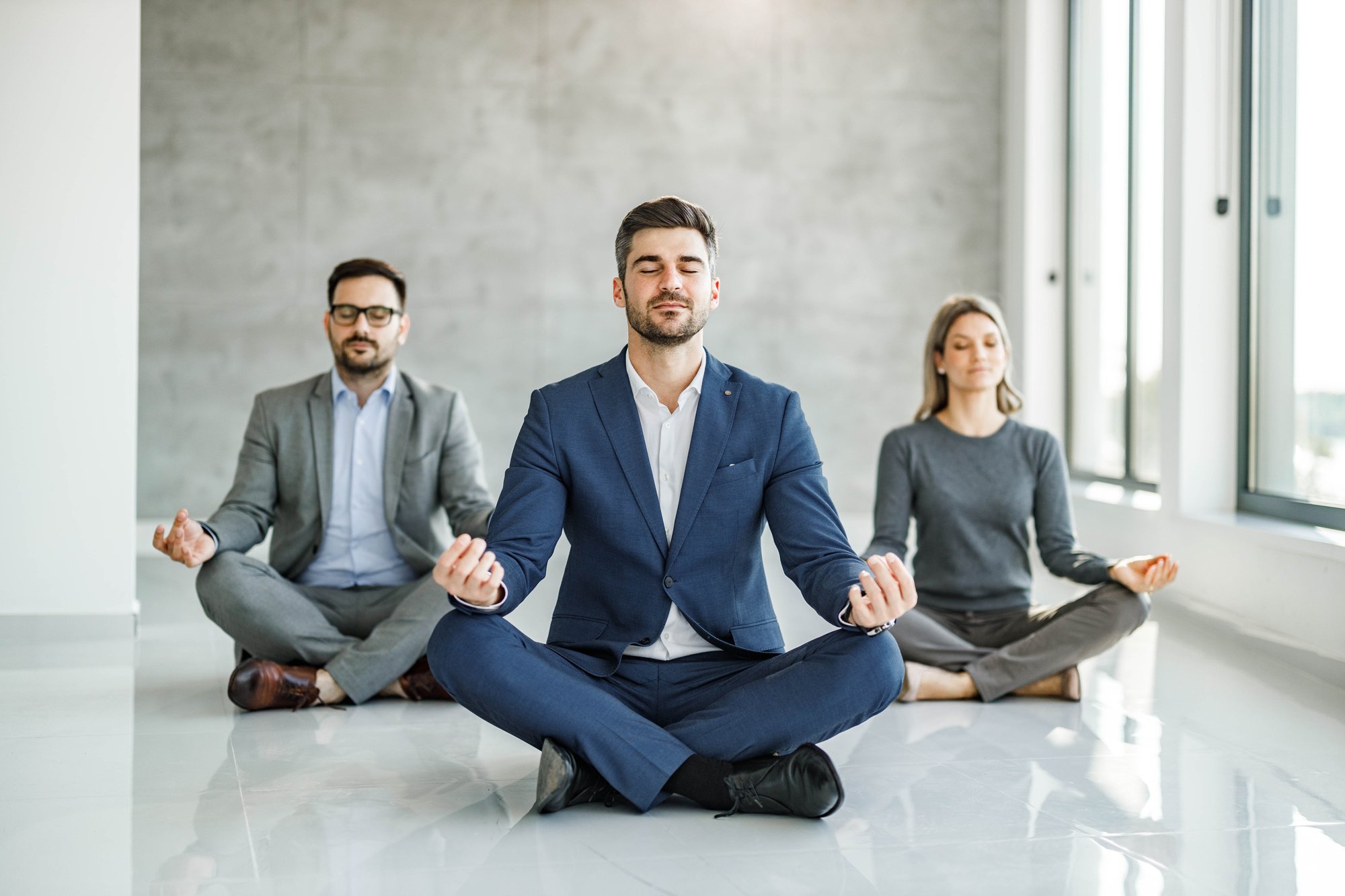 Relaxed-business-team-exercising-Yoga-in-the-office.-1259844562_6720x4480 Relaxed-business-team-exercising-Yoga-in-the-office.-1259844562_6720x4480